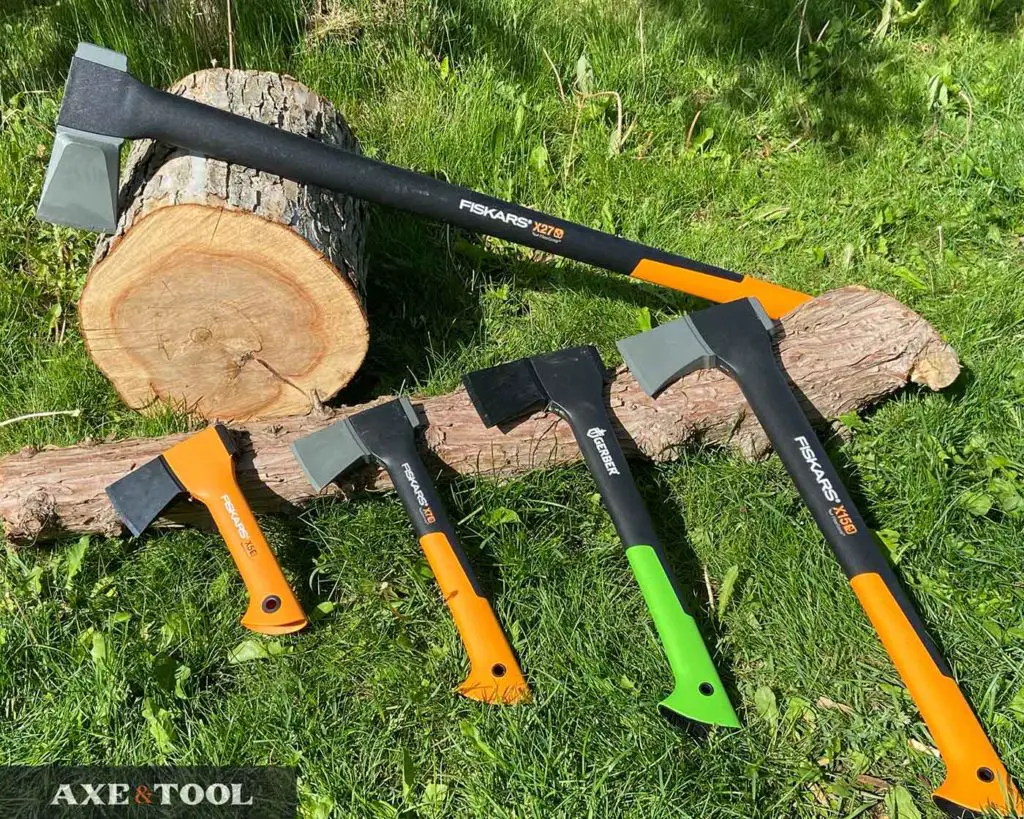 Gerber and Fiskars axes laying on the ground