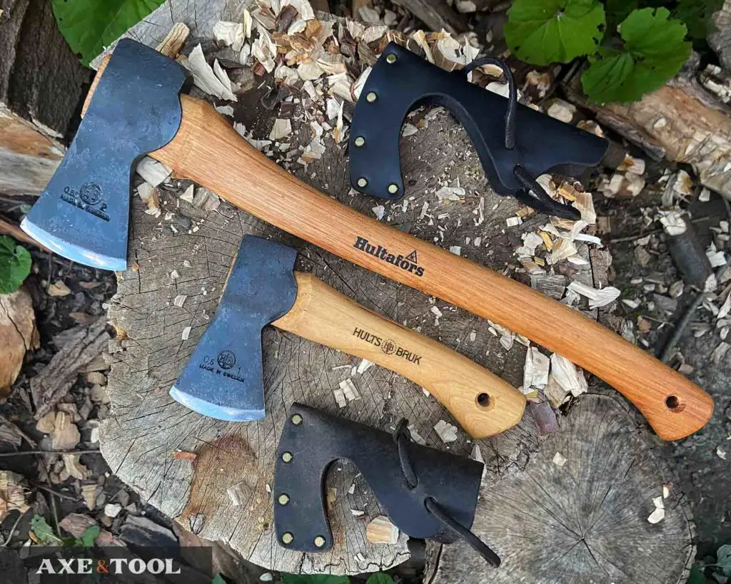 Hults Bruk and Hultafors axes laying next to each other on a log