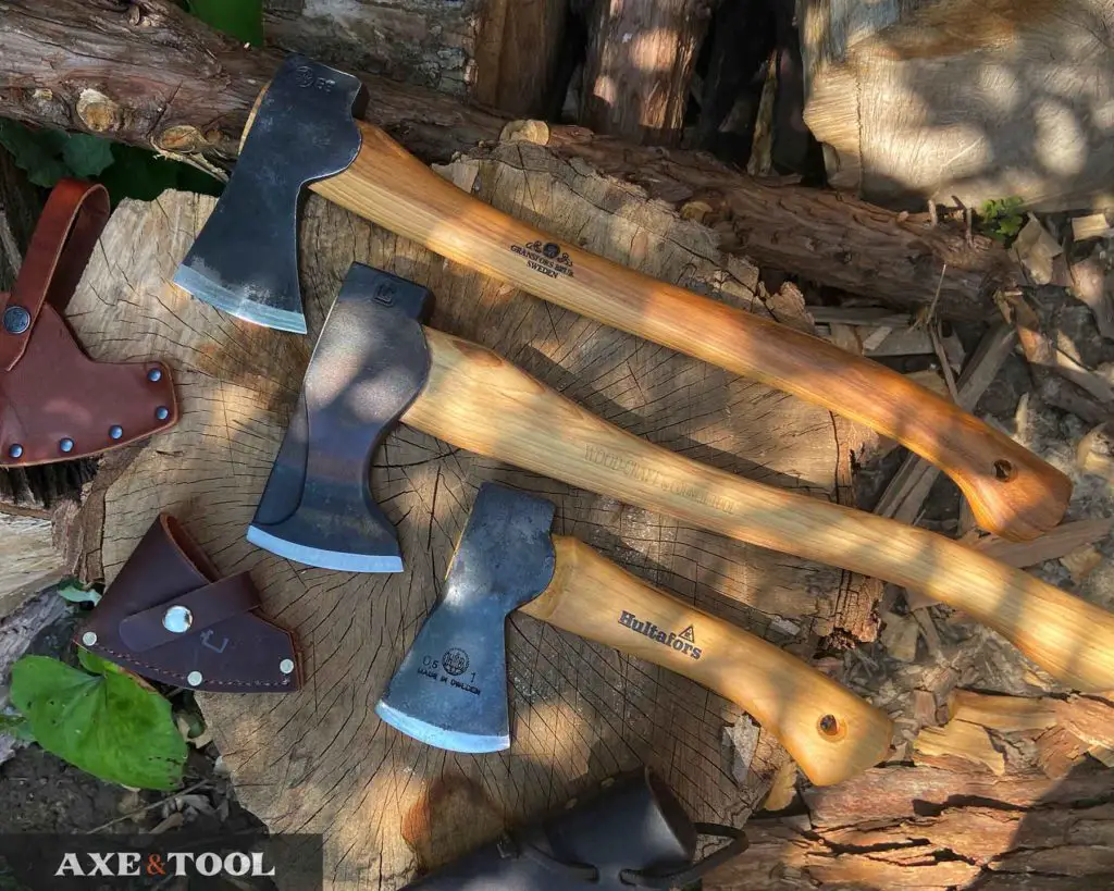 gransfors bruk, council tool, and hultafors premium axes sitting on a log