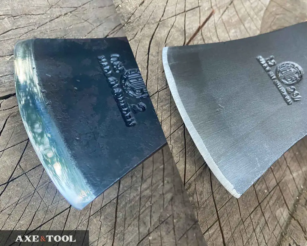 hultafors premium axe blade next to a standard axe blade