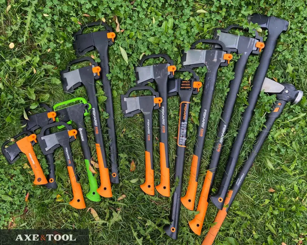 Every model of Fiskars Axe laid out in the grass for size comparison