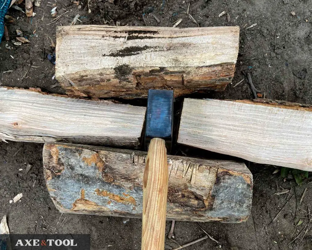 hatchet splitting camp firewood in half