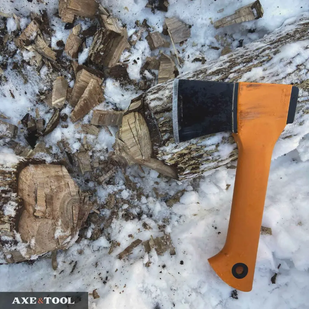 Fiskars X5 and a chopped log in the snow