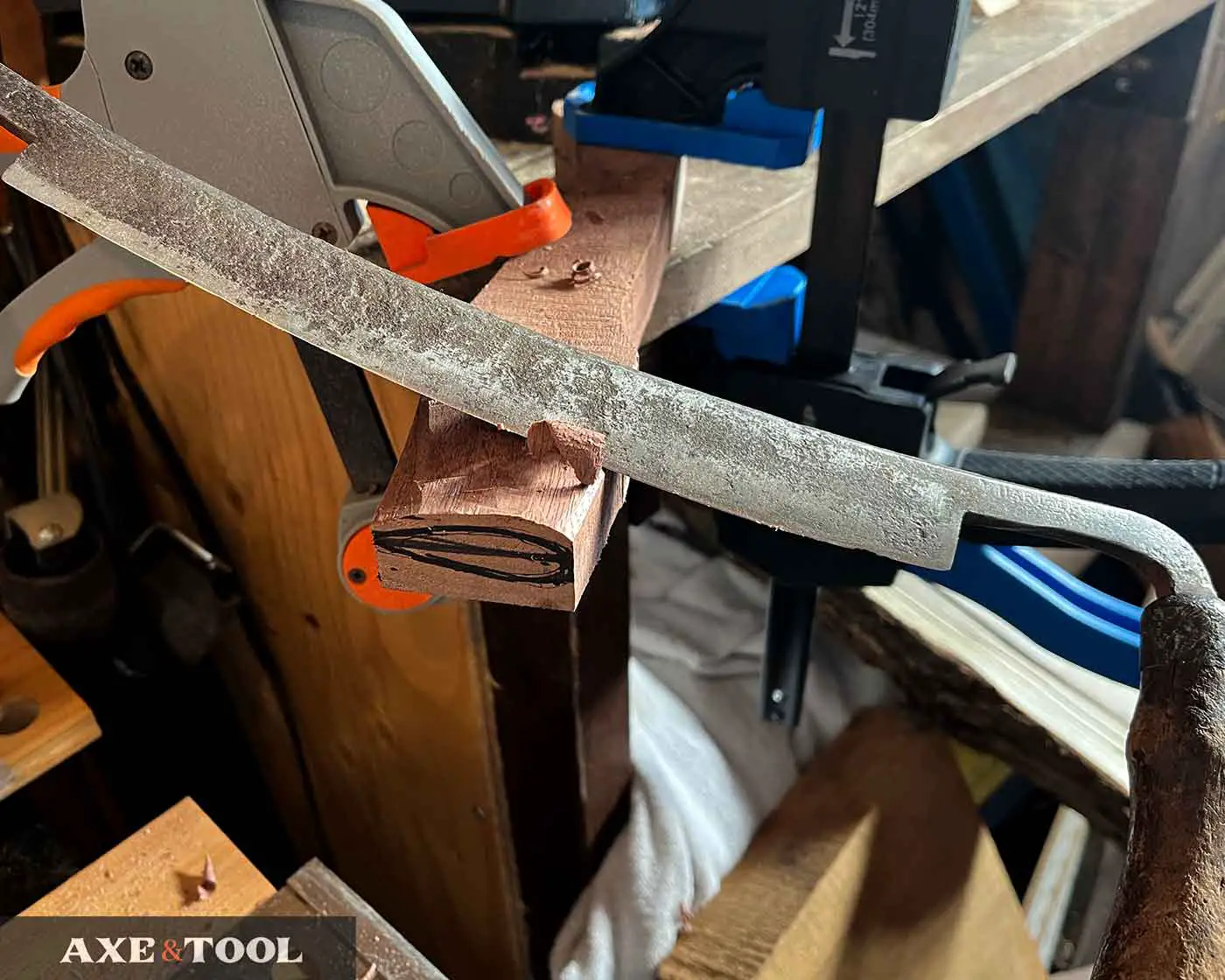 shaping axe handle eye with drawknife
