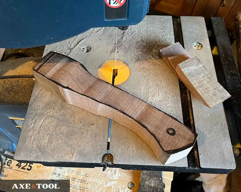 cut out axe handle shape with saw