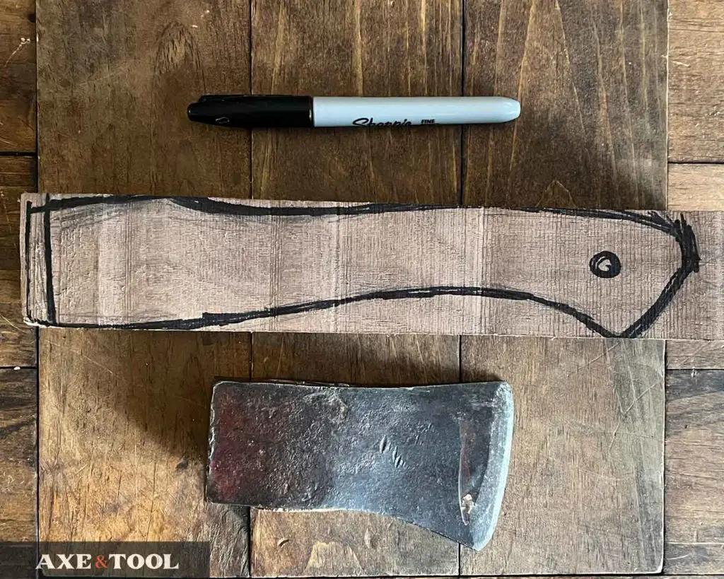 axe handle shape traced on wood
