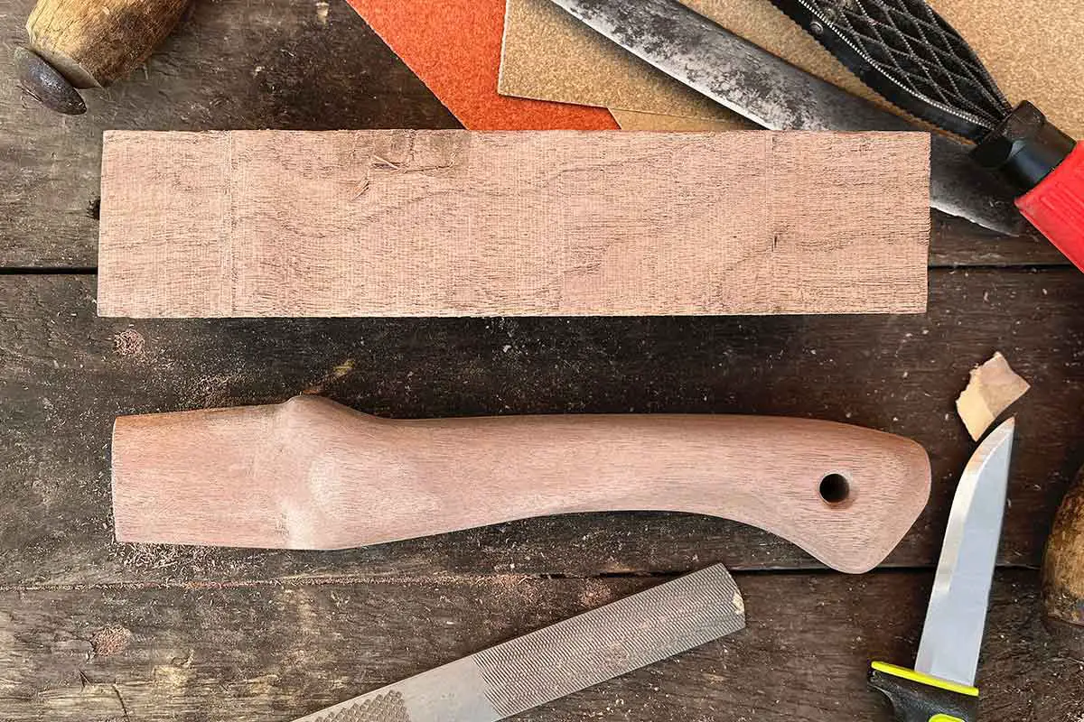 A kitchen axe I hand carved an ash handle for. Also hand cut and hand  stitched the sheath. : r/Axecraft