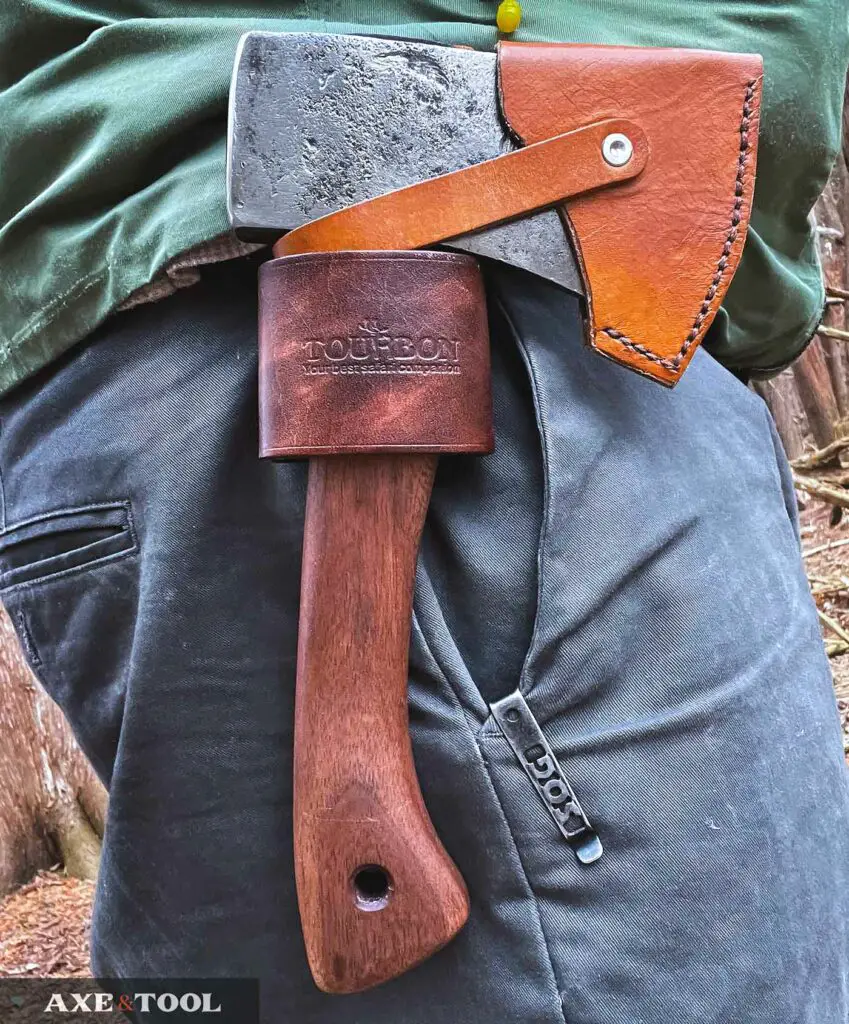 Hatchet being carried on a belt loop in the woods