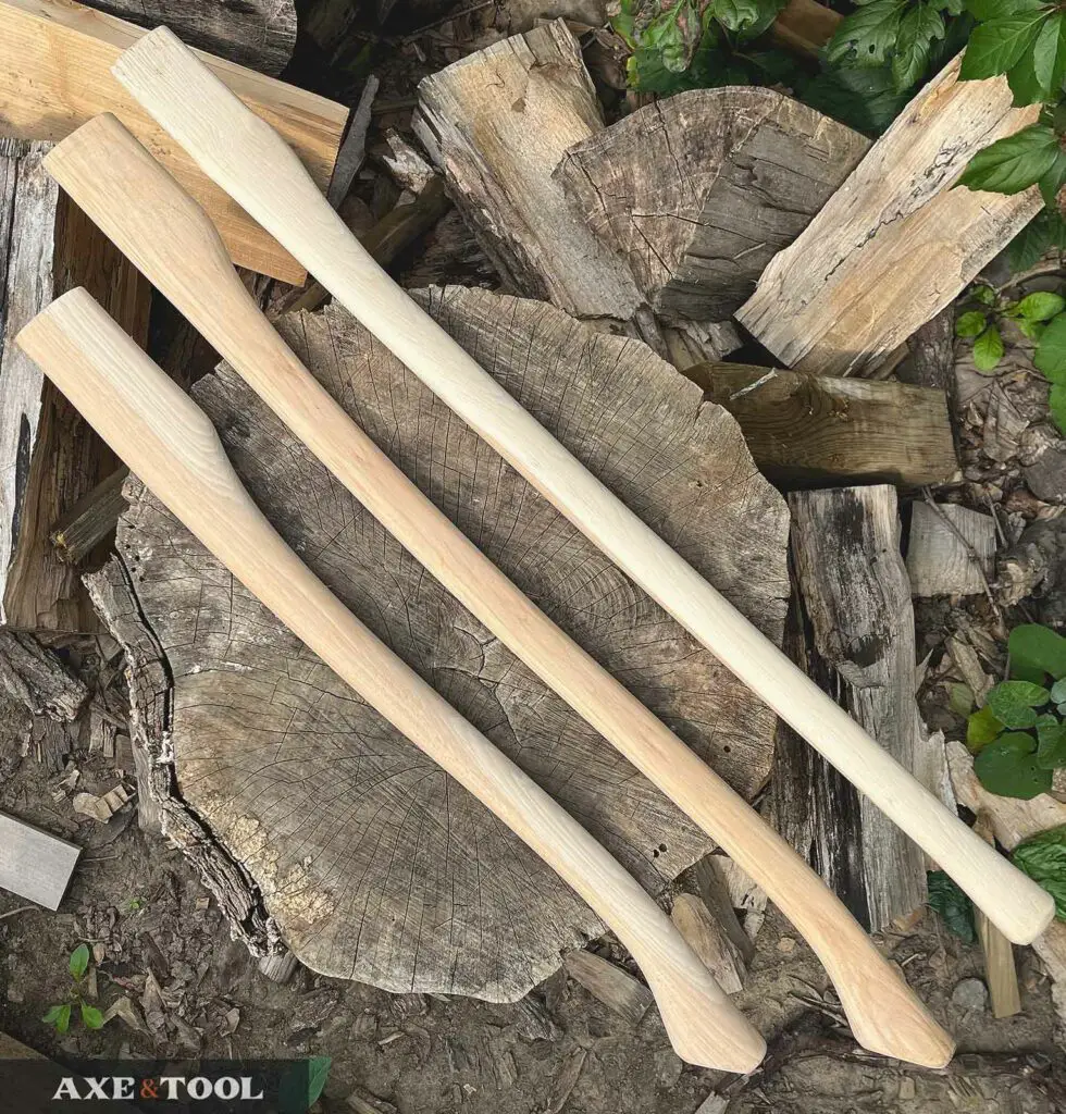 straight and curved axe handles on a log