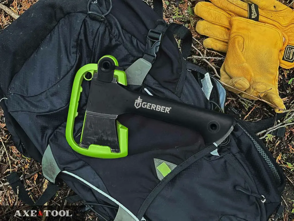 Gerber 9-inch hatchet sitting on a day pack in the woods
