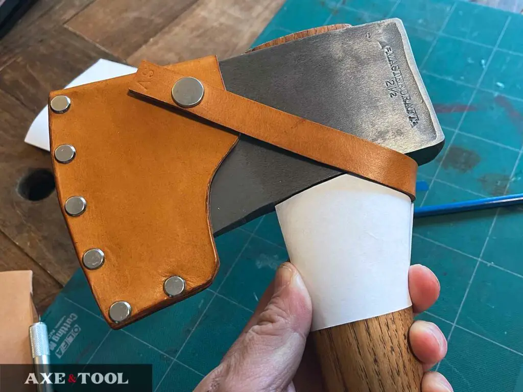 Designing an axe's leather overstrike guard