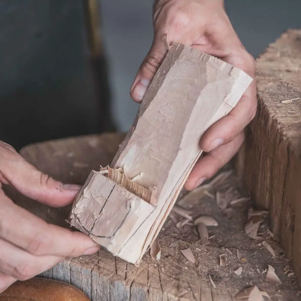 a carving in progress with an axe