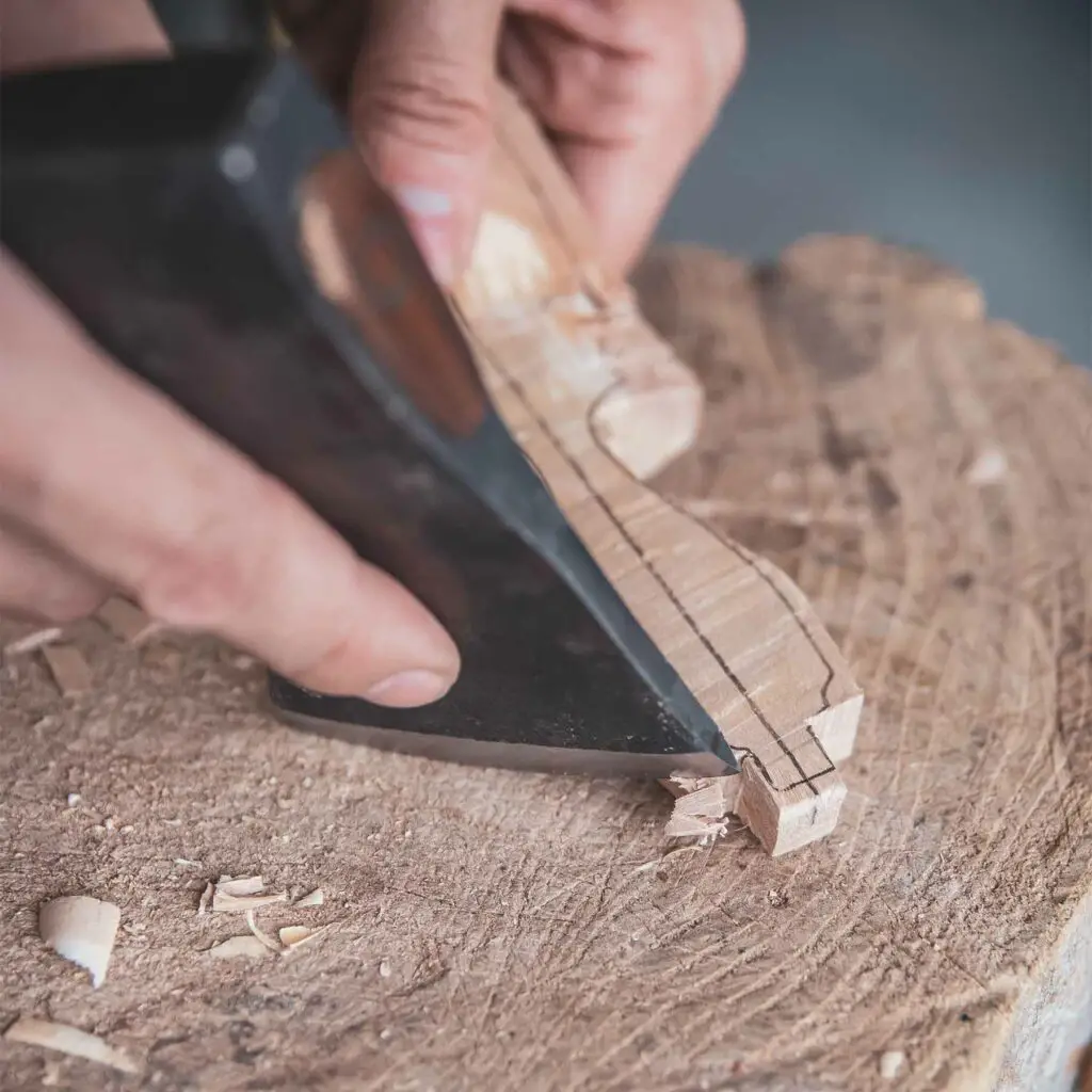 Guillotine cut while axe carving a spoon handle
