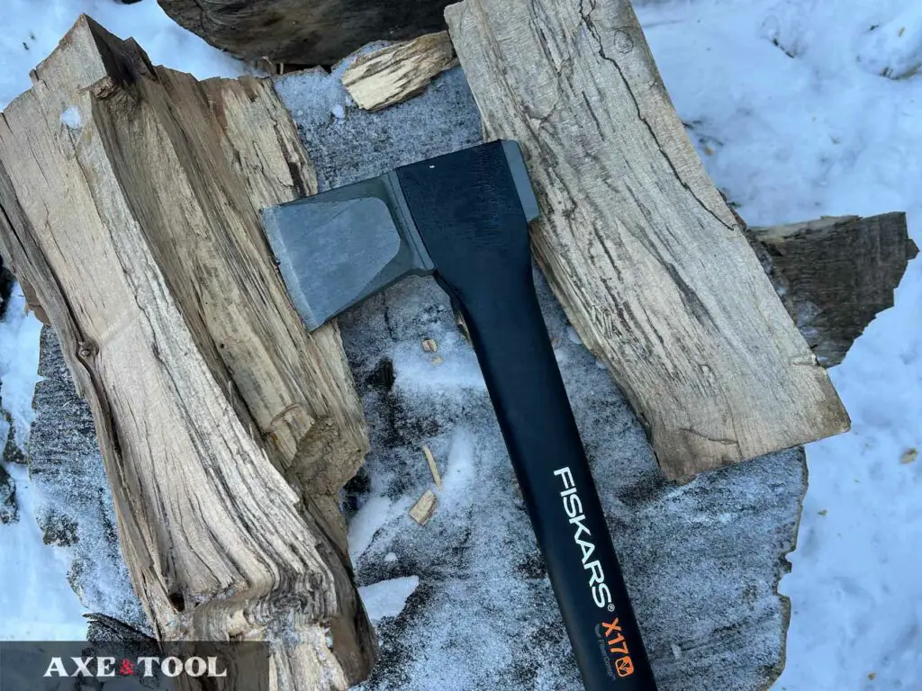 Fiskars X17 Axe splitting logs in the snow
